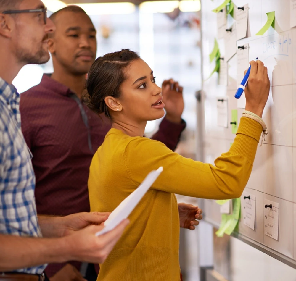 Colleagues working together on an idea tree